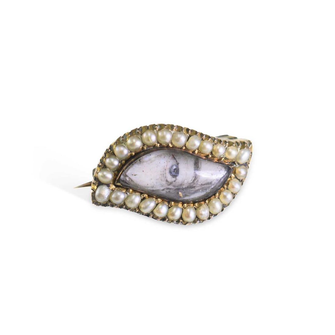 § AN EARLY 19TH CENTURY GOLD AND SEED PEARL LOVER’S EYE BROOCH: § AN EARLY 19TH CENTURY GOLD AND SEED PEARL LOVER’S EYE BROOCH of navette form, centred by a glazed eye miniature within a border of seed pearls, fitted with a pin to the reverse. 2cm wide, 3.3