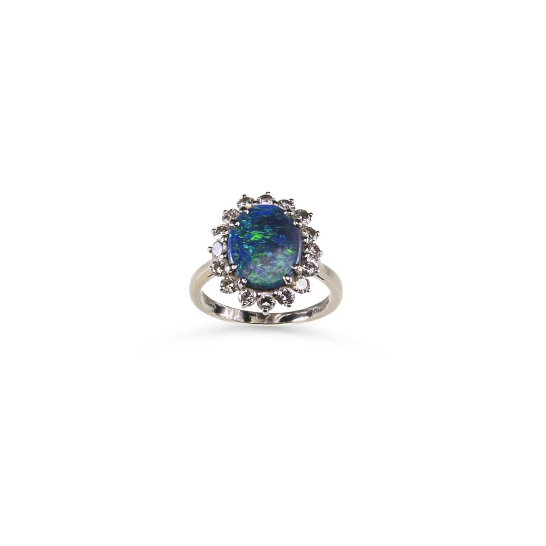 AN 18 CARAT WHITE GOLD BLACK OPAL AND DIAMOND CLUSTER RING: AN 18 CARAT WHITE GOLD BLACK OPAL AND DIAMOND CLUSTER RING an oval black opal within an border of round brilliant-cut diamonds, hallmarked London 1975. Estimated total diamond weight 0.80 carat, ring