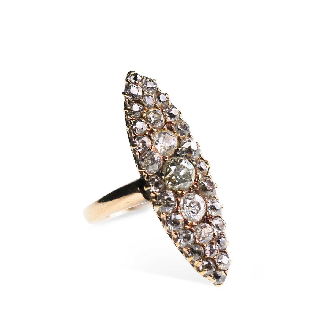 A DIAMOND NAVETTE RING: A DIAMOND NAVETTE RING graduated old-cut diamonds in a navette setting, unmarked. Estimated total diamond weight 2.50 carat, ring size I, 4.5 grams, bezel 3cm long Good condition. Estimated diamond co