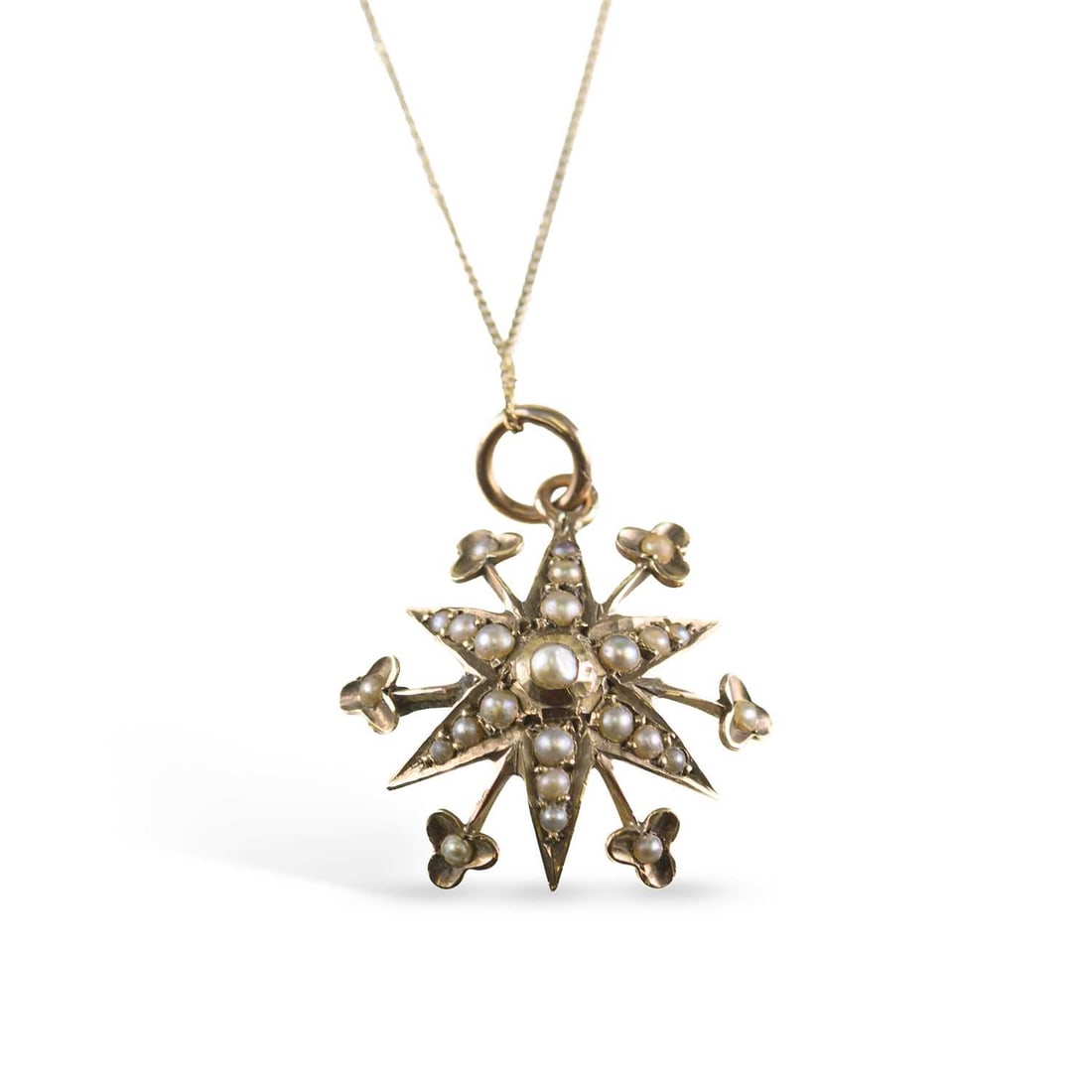 A SEED PEARL STAR PENDANT ON CHAIN: A SEED PEARL STAR PENDANT ON CHAIN a star pendant with foliate radial arms, set throughout with seed pearls, to a later fine chain necklace, stamped '9CT'. Pendant 2.5cm long, 1.9 grams Light wear to