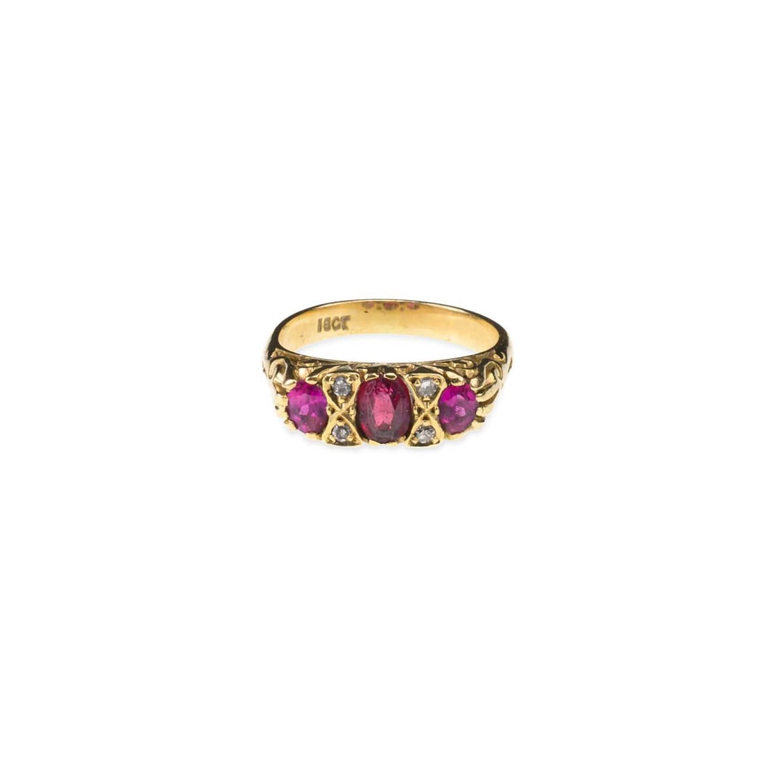 A GARNET TOPPED DOUBLET AND RUBY RING: A GARNET TOPPED DOUBLET AND RUBY RING an oval-cut garnet topped doublet spaced by pairs of oval-cut rubies, spaced by diamond accents, stamped '18CT'. Ring size I, 4.5 grams Good condition