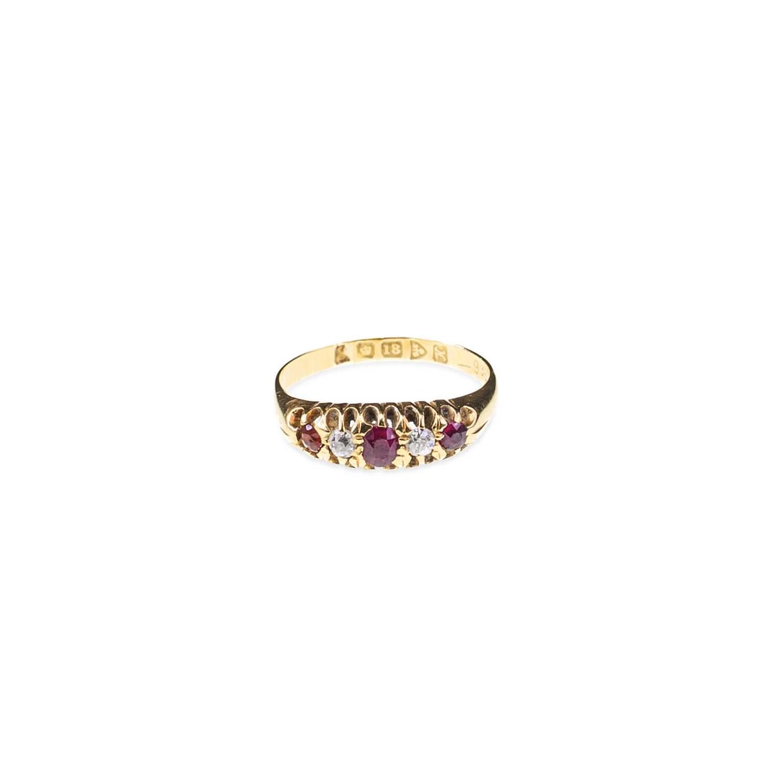 AN 18 CARAT GOLD GARNET AND DIAMOND RING: AN 18 CARAT GOLD GARNET AND DIAMOND RING three cushion-cut garnets spaced by old-cut diamonds, hallmarked Chester 1908. Ring size J1/2, 2.9 grams Some light abrasion to stones, band worn to an edge