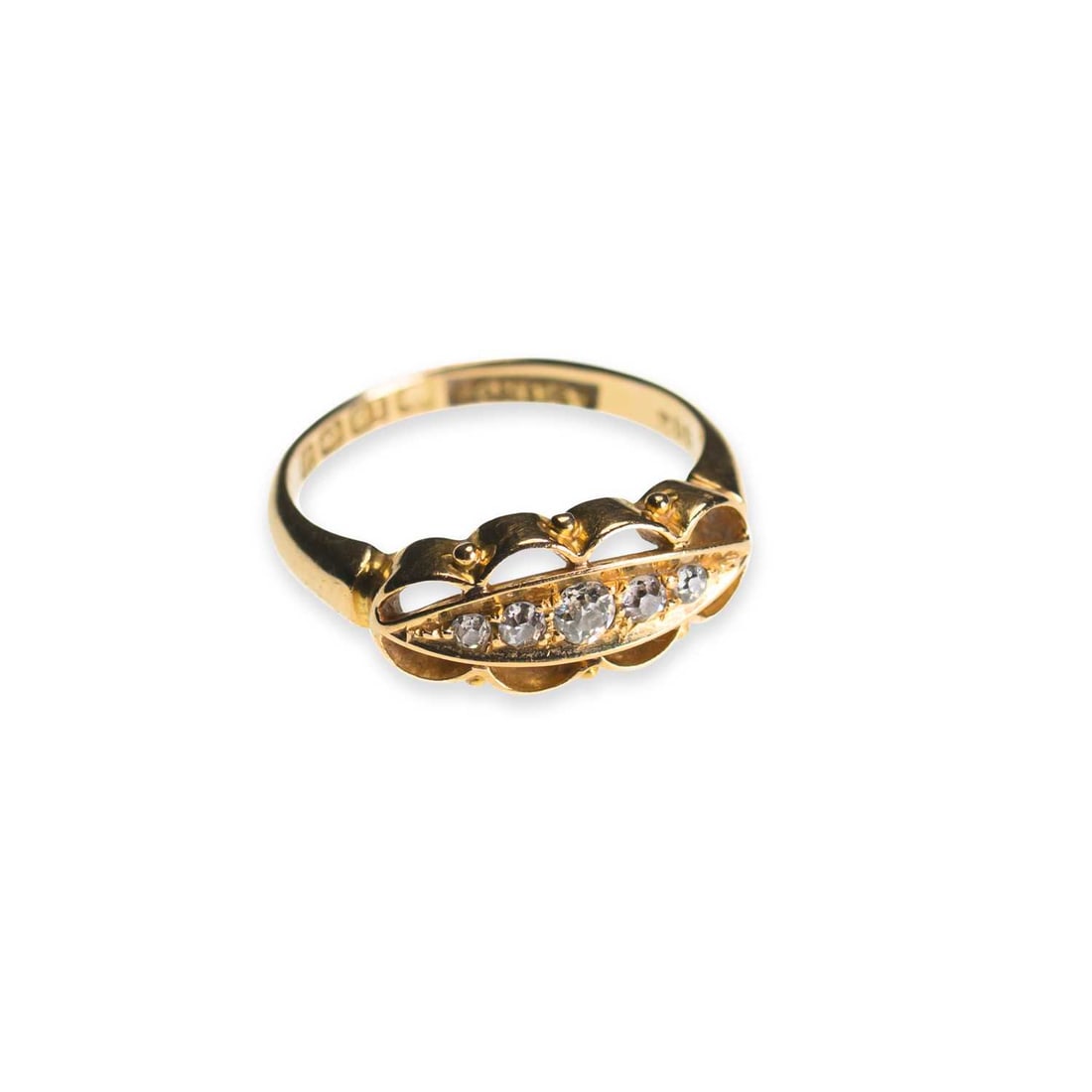AN 18 CARAT GOLD DIAMOND RING: AN 18 CARAT GOLD DIAMOND RING graduated old-cut diamonds in a pierced setting, hallmarked Birmingham 1912. Ring size J1/2, 3.1 grams Good condition