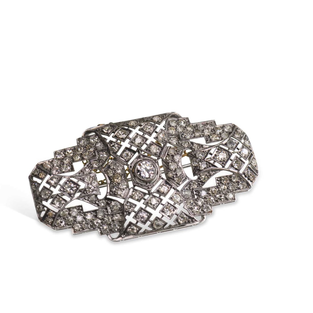 AN ART DECO DIAMOND BROOCH: AN ART DECO DIAMOND BROOCH a round-cut diamond within a pierced milgrain-set diamond stepped frame, unmarked. Estimated total diamond weight 3.10 carat, 5.5cm long, 14.1 grams Pin clasp detached but