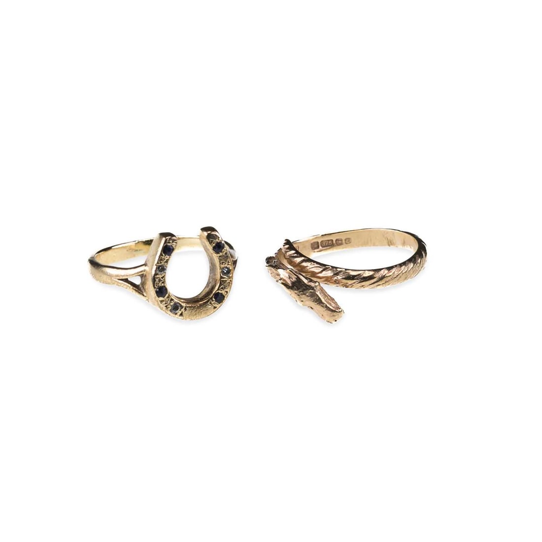 TWO 9 CARAT GOLD EQUESTRIAN RINGS: TWO 9 CARAT GOLD EQUESTRIAN RINGS comprising a gem-set horseshoe ring, hallmarked; and a horse head crossover ring, hallmarked. (2) Ring sizes K and I, 6.2 grams gross Good condition