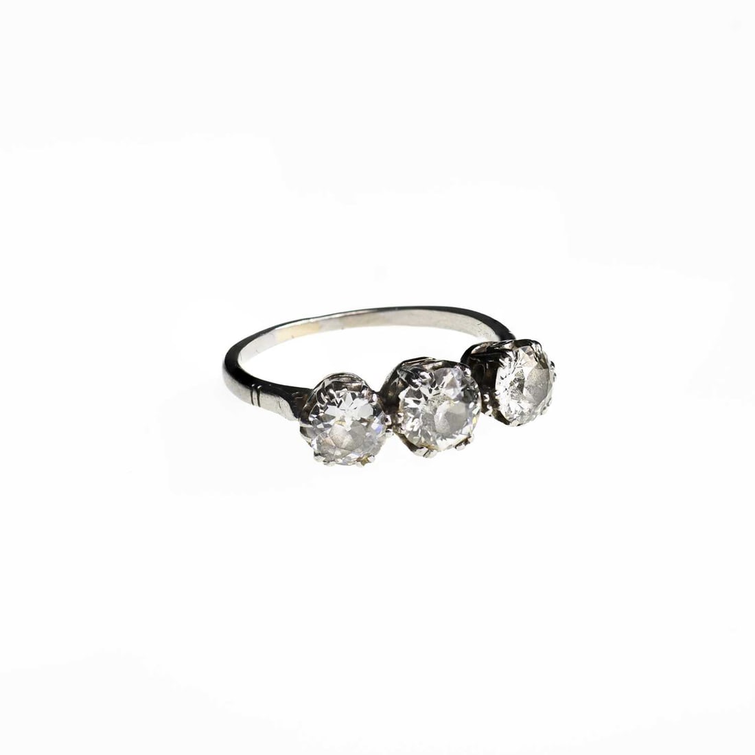 AN 18 CARAT GOLD DIAMOND THREE STONE RING: AN 18 CARAT GOLD DIAMOND THREE STONE RING graduated old-cut diamonds in claw settings, unmarked. Estimated total diamond weight 1.95 carat, ring size P1/2, 4.0 grams Band a little thin, resized and sl