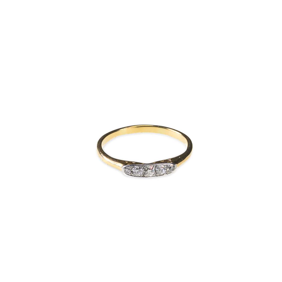 AN OLD-CUT DIAMOND RING: AN OLD-CUT DIAMOND RING five graduated old-cut diamonds in a milgrain bar setting, unmarked. Estimated total diamond weight 0.20 carat, ring size N, 2 grams Good condition. Estimated diamond colour: H