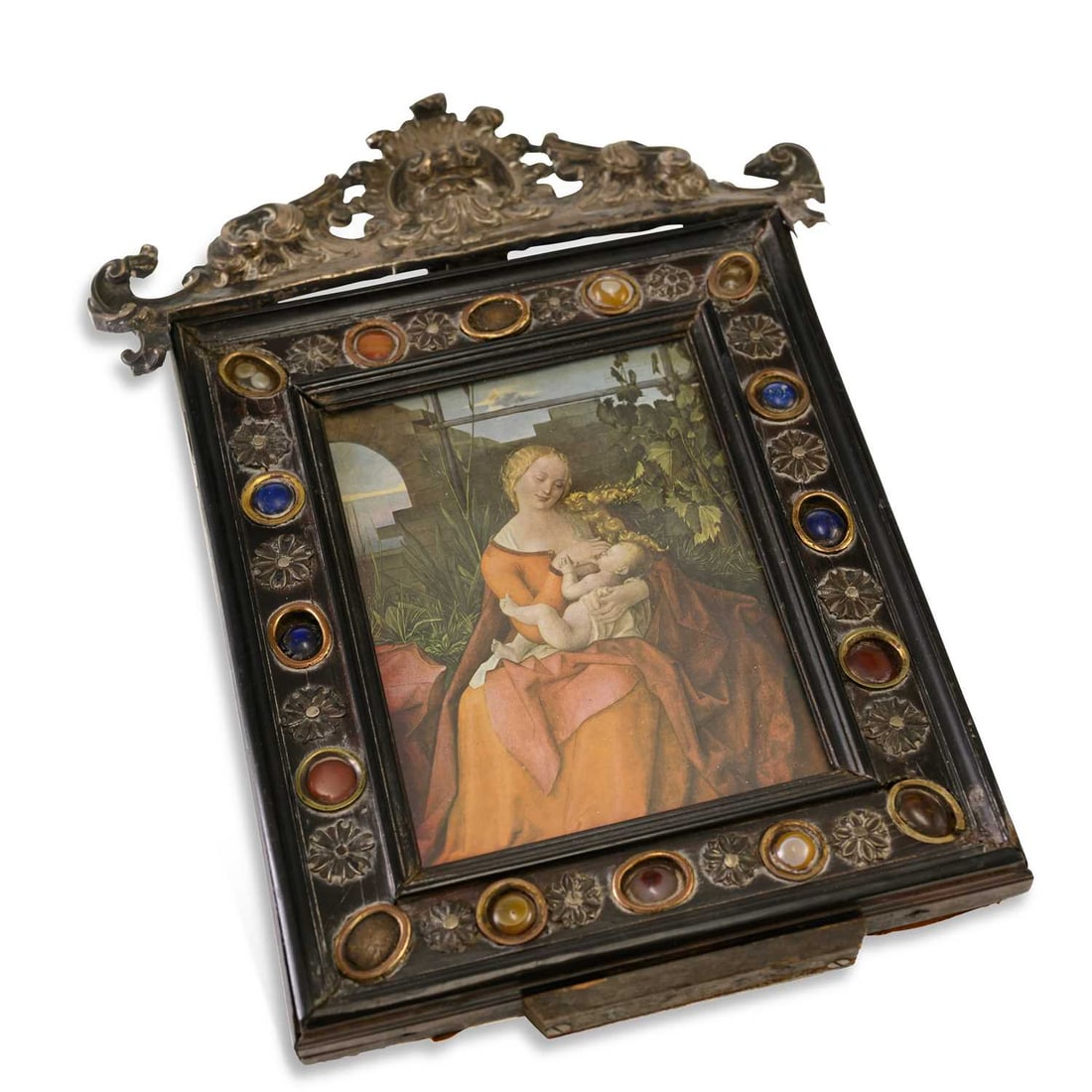 AN ITALIAN FRAME FLORENTINE, 18TH CENTURY: AN ITALIAN FRAME FLORENTINE, 18TH CENTURY the ebonised moulded frame applied with gilt-metal flowerheads and oval hardstone cabochons, surmounted by a pierced foliate crest and enclosing a print of th