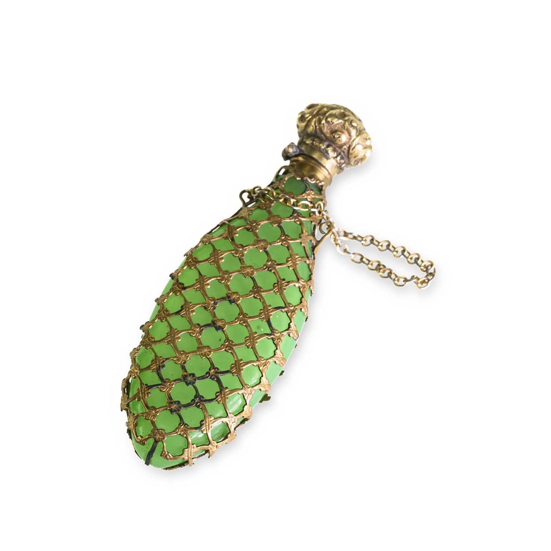 A SILVER-GILT CAGEWORK AND GREEN GLASS SCENT BOTTLE LATE 19TH CENTURY: A SILVER-GILT CAGEWORK AND GREEN GLASS SCENT BOTTLE LATE 19TH CENTURY of compressed oval form, the cover chased with foliate scrolls. 9cm long