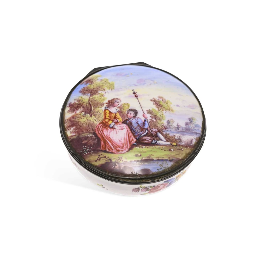A LARGE FRENCH ENAMEL BOX 19TH CENTURY: A LARGE FRENCH ENAMEL BOX 19TH CENTURY circular form, enamelled to the cover with a scene of a courting couple in a rural landscape, the base painted with sprigs of flowers. 10cm diameter