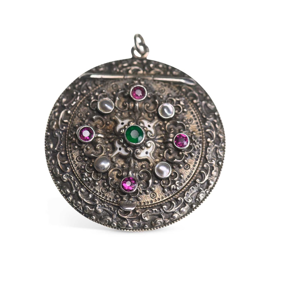 AN AUSTRO HUNGARIAN SILVER GEM-SET COMPACT: AN AUSTRO HUNGARIAN SILVER GEM-SET COMPACT the foliate cast compact with a hinged cover set with coloured paste and mother-of-pearl, with a mirrored interior, stamped '935'. 4.5cm diameter, 40 grams G