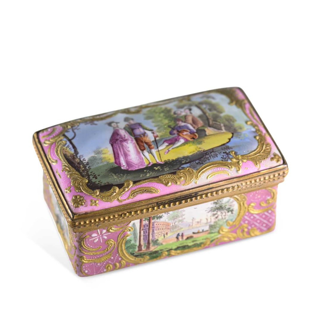 A SOUTH STAFFORDSHIRE ENAMEL SNUFF BOX CIRCA 1780: A SOUTH STAFFORDSHIRE ENAMEL SNUFF BOX CIRCA 1780 rectangular with gilt-metal mounts, the pink ground richly decorated with raised gilt Rococo scrollwork and finely painted pastoral and architectural
