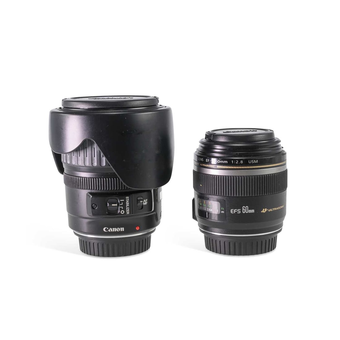 TWO CANON LENSES: TWO CANON LENSES comprising a Canon EF-S 60mm f/ 2.8 USM Macro lens; and a Canon EF 28-135mm f/ 3.5-5.6 IS Zoom lens. (2) First 9cm high