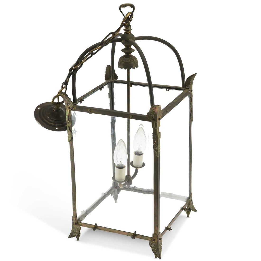 AN EARLY 20TH CENTURY BRASS HALL LANTERN: AN EARLY 20TH CENTURY BRASS HALL LANTERN of square-section with applied leaf-form mounts to the corners. 79cm high (excl. chain)