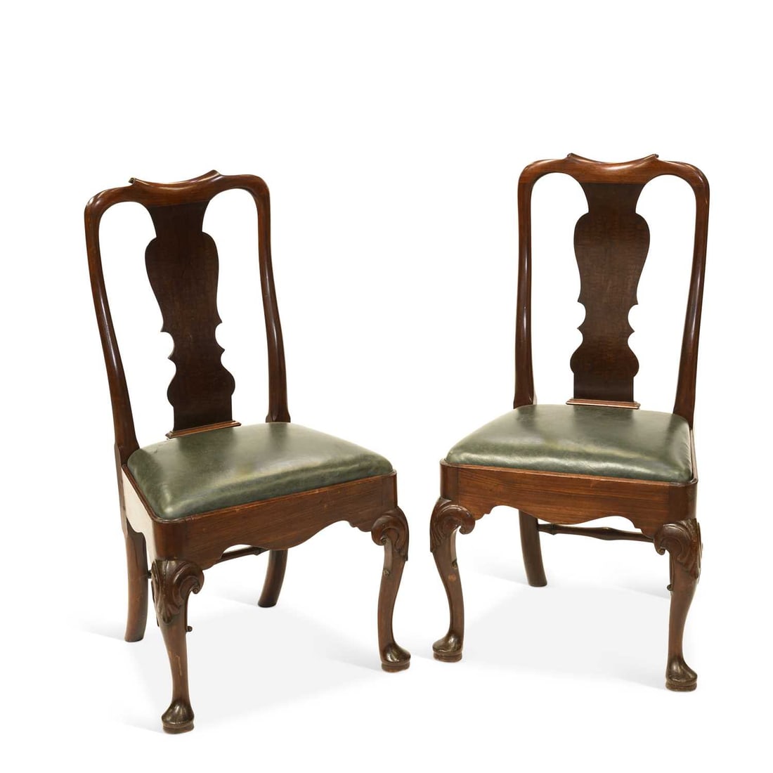 A PAIR OF GEORGE II MAHOGANY SIDE CHAIRS: A PAIR OF GEORGE II MAHOGANY SIDE CHAIRS each with shaped splat back above a drop-in seat upholstered in green leatherette, raised on cabriole legs with shell carved knees and pad feet. (2) Height of 