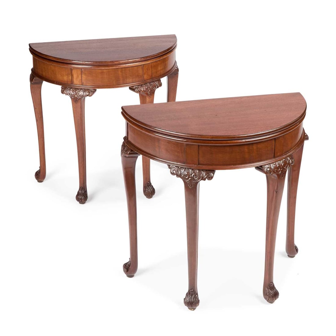 A PAIR OF GEORGIAN STYLE MAHOGANY DEMILUNE FOLDOVER CARD TABLES EARLY 20TH CENTURY: A PAIR OF GEORGIAN STYLE MAHOGANY DEMILUNE FOLDOVER CARD TABLES EARLY 20TH CENTURY raised on cabriole legs terminating in scroll feet. (2) 76cm high, 76cm wide, 38cm deep (closed)