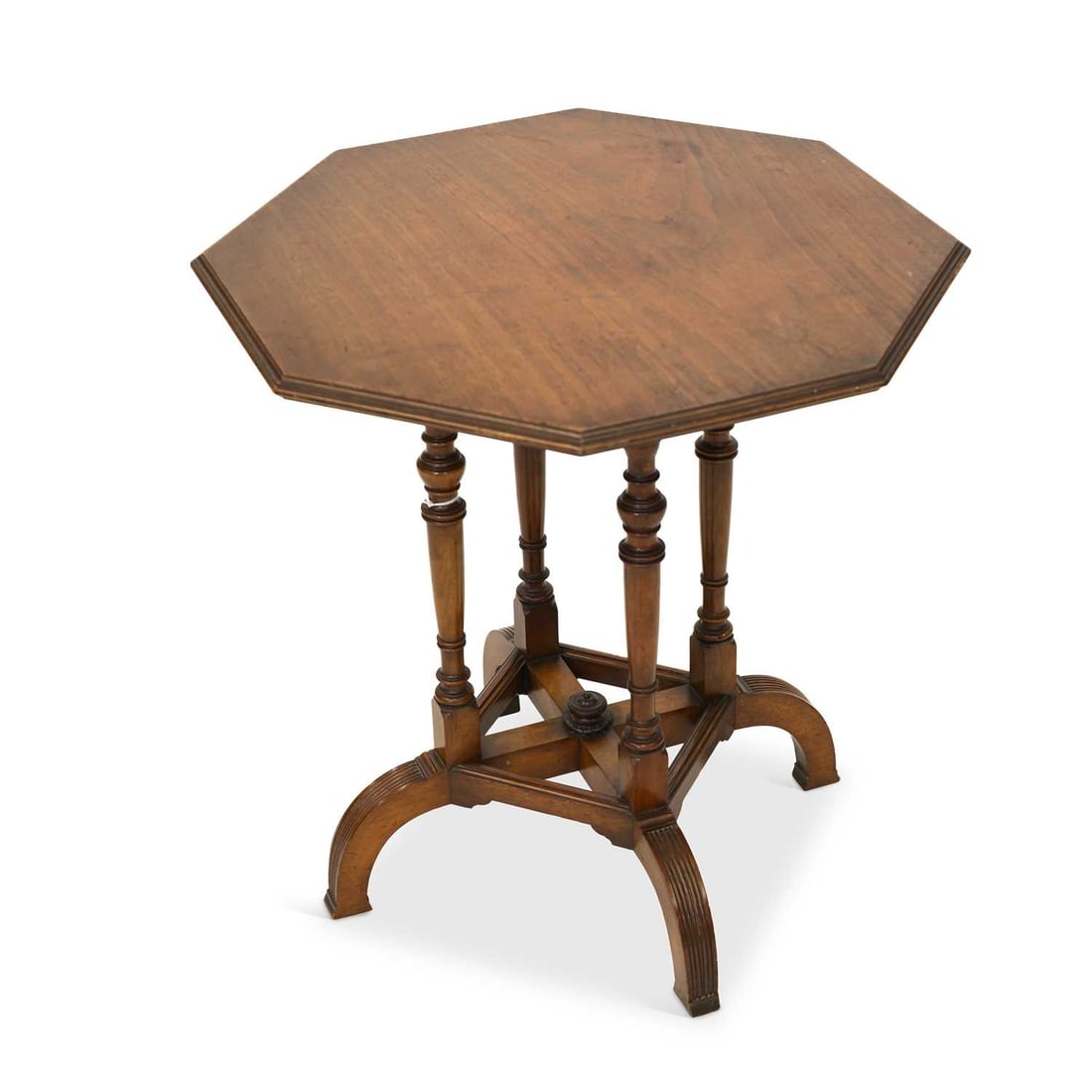 A WALNUT OCTAGONAL CENTRE TABLE, CIRCA 1870 STAMPED C. HINDLEY & SONS, OXFORD STREET, LONDON: A WALNUT OCTAGONAL CENTRE TABLE, CIRCA 1870 STAMPED C. HINDLEY & SONS, OXFORD STREET, LONDON the top with a reeded edge, on four turned and reeded legs united by cross stretchers and centred by a turn