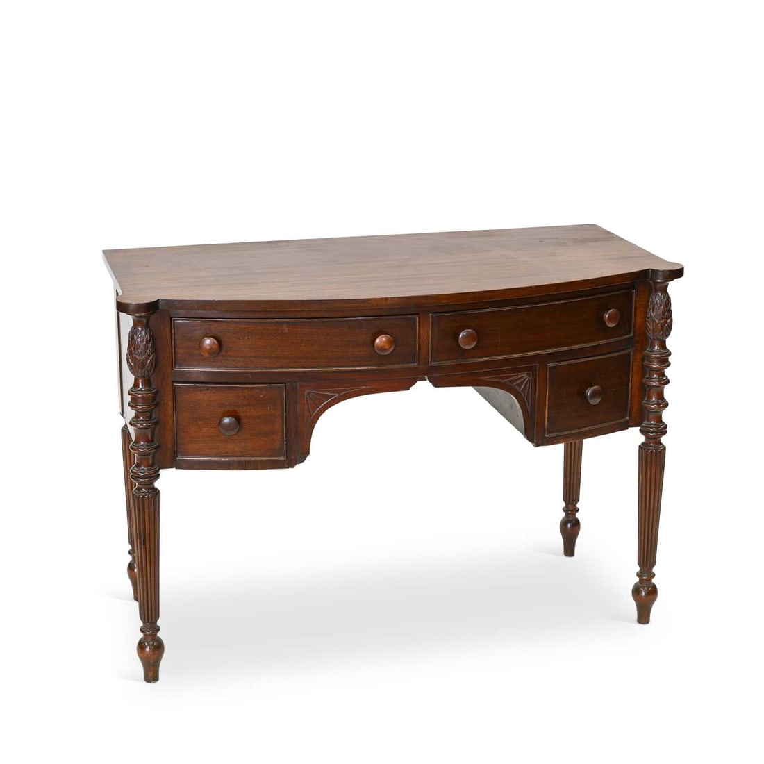 A REGENCY STYLE MAHOGANY BOW-FRONT SIDE TABLE: A REGENCY STYLE MAHOGANY BOW-FRONT SIDE TABLE with four drawers, raised on reeded tapering legs. 77cm high, 110cm wide, 52cm deep