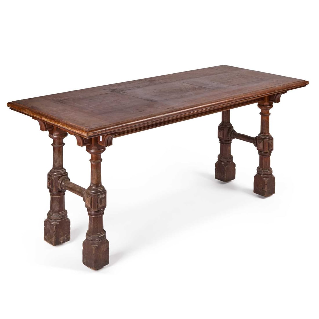 A MAHOGANY LIBRARY TABLE CIRCA 1870, LABEL OF MARSH, JONES & CRIBB: A MAHOGANY LIBRARY TABLE CIRCA 1870, LABEL OF MARSH, JONES & CRIBB the rectangular parquetry top raised above a plain frieze on turned, block and chamfered legs joined by stretchers. 77cm high, 182.5c