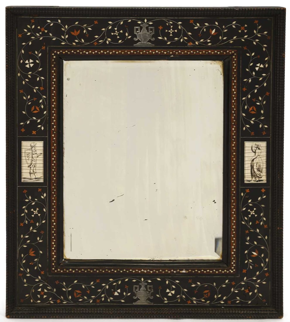 § A 19TH CENTURY ITALIAN INLAID AND EBONISED MIRROR: § A 19TH CENTURY ITALIAN INLAID AND EBONISED MIRROR of rectangular form, decorated with vases, scrolling foliage and figural panels. 56cm by 47cm With non-transferable standard ivory exemption