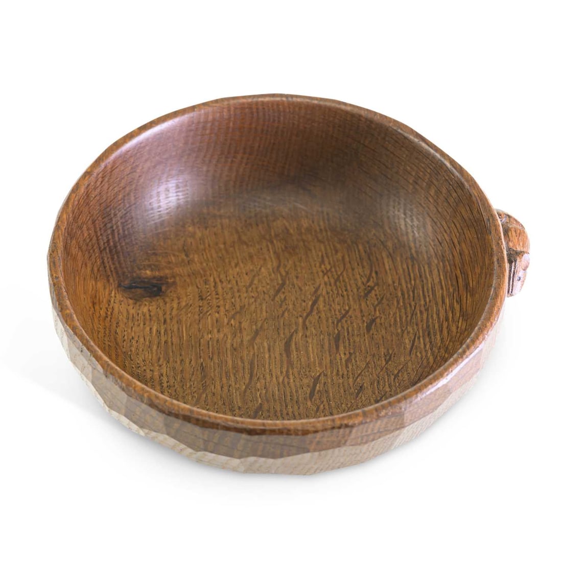 ROBERT THOMPSON OF KILBURN A MOUSEMAN OAK NUT BOWL: ROBERT THOMPSON OF KILBURN A MOUSEMAN OAK NUT BOWL adzed exterior, with carved mouse signature. 16cm diameter
