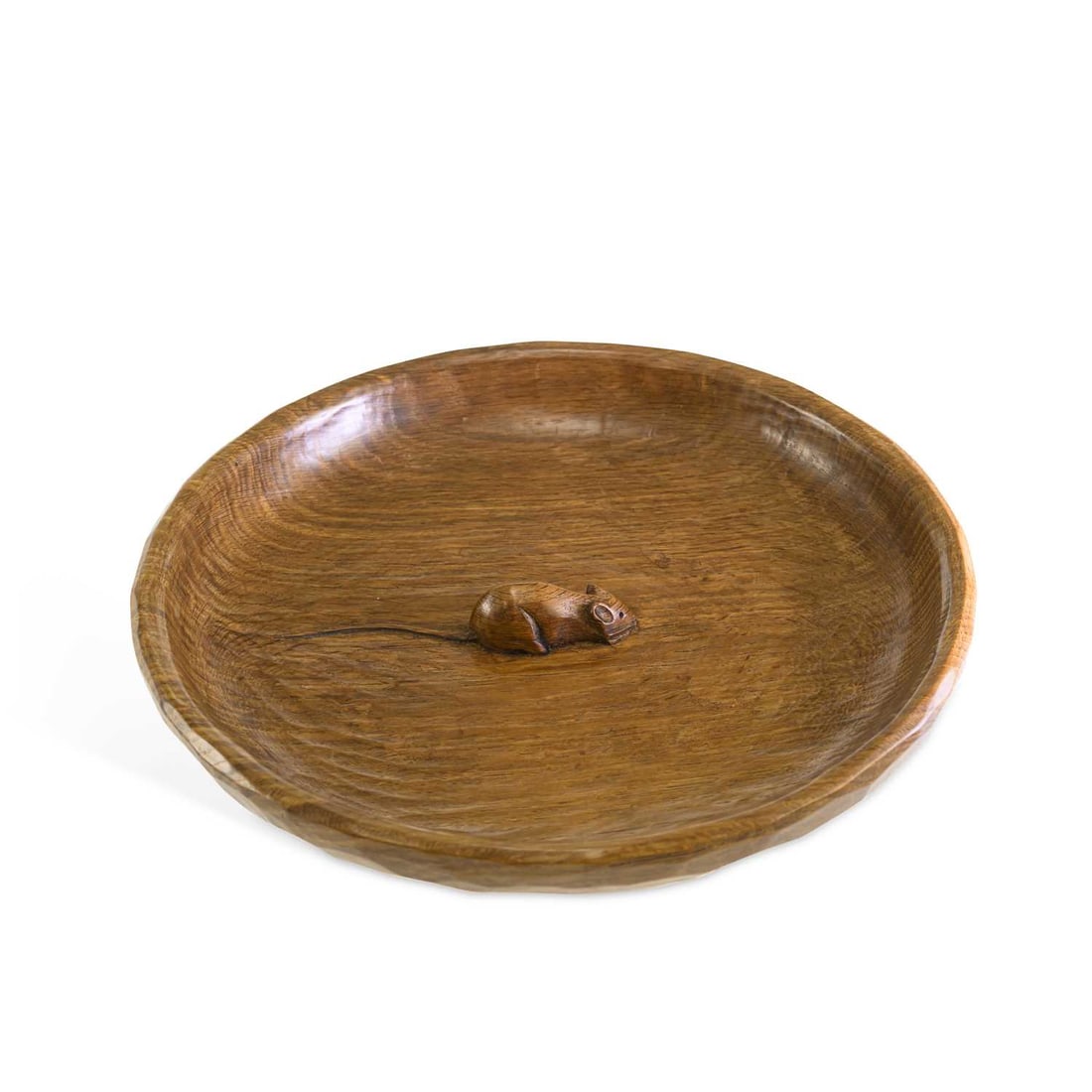 ROBERT THOMPSON OF KILBURN A MOUSEMAN OAK FRUIT BOWL: ROBERT THOMPSON OF KILBURN A MOUSEMAN OAK FRUIT BOWL with adzed exterior and tooled interior, carved mouse signature to the centre. 29.5cm diameter