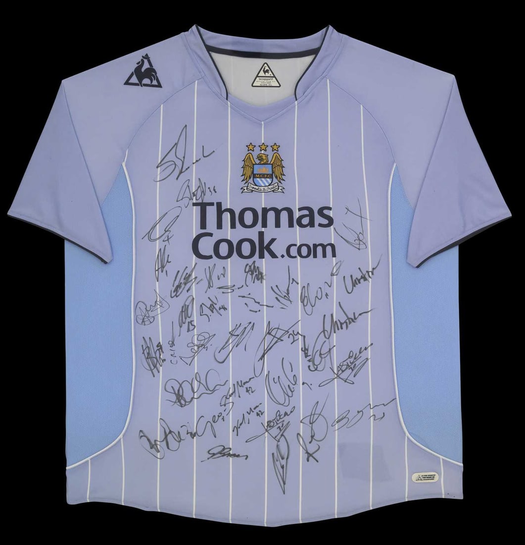 FOOTBALL MEMORABILIA: A MANCHESTER CITY MULTI SIGNED 2008 - 9 SEASON SHIRT: by Le Coq Sportif, home kit, signed in black felt pen by players including; Elano, and thirty-six further signatures, with plaque applied to the lower edge reading Manchester City FV 2008/9 / What a N
