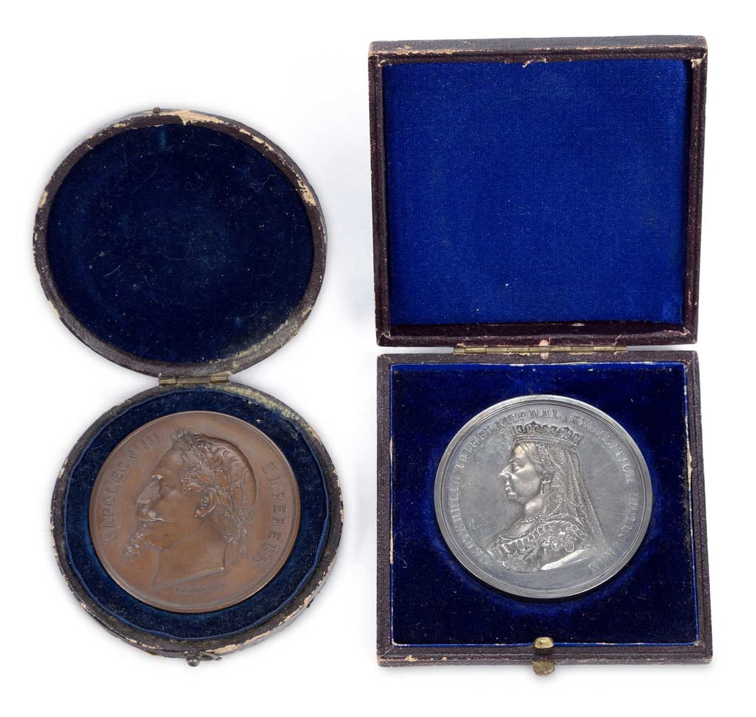 AN 1888 CENTENNIAL INTERNATIONAL EXHIBITION SILVER PRIZE MEDALLION: with a crowned bust of Queen Victoria facing left to one side, the reverse with a motto within a wreath, named T. F. Firth and Sons to the edge, within the fitted case of issue; together with a