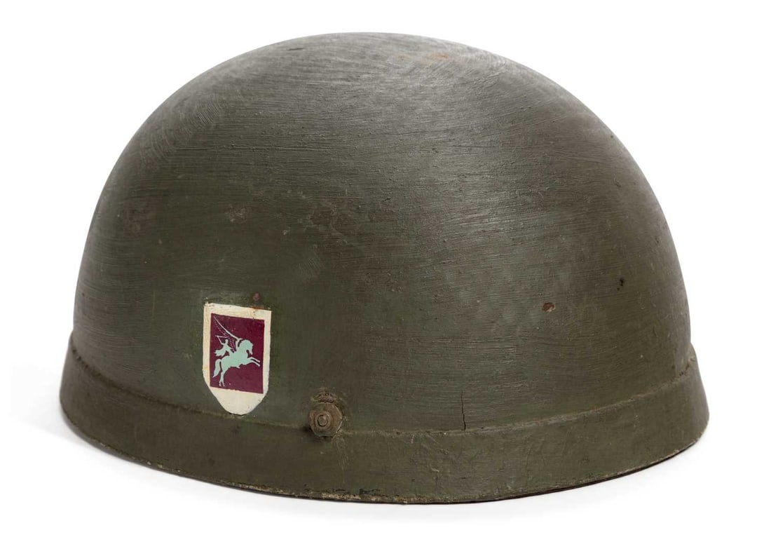 A SECOND WORLD WAR FIBRE RIM AIRBORNE FORCES/ PARATROOPER HELMET: with camouflage net, stamped BMB for Briggs Motor Bodies Ltd size 71/8 and dated 1942, retaining the original liner and leather chin strap.