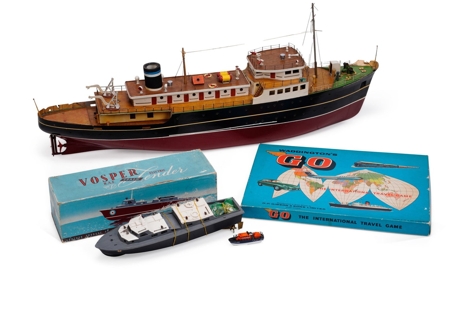 A SCRATCH BUILT MODEL OF THE LIVERPOOL PILOT SHIP 'SIR THOMAS BROCKLEBANK' 20TH CENTURY: together with a Vosper Industries R.A.F. Crash Tender, with original box; and a Waddingtons Go board game. (3) First 110cm by 20cm by 45cm