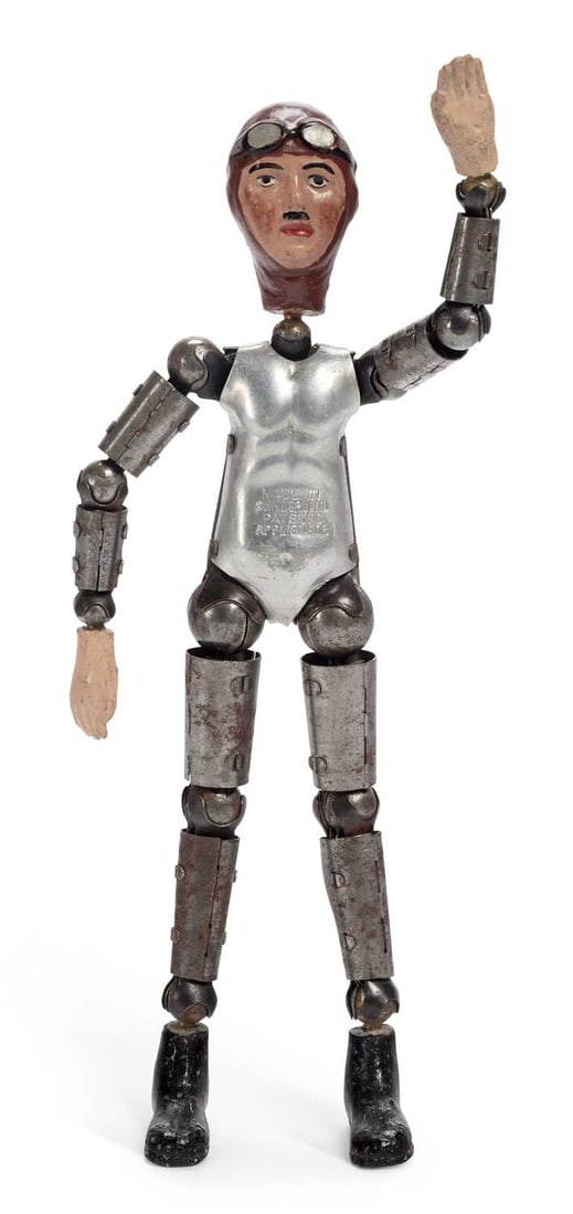 AN EARLY 20TH CENTURY SWISS 'SABA' ARTICULATED METAL FIGURE OF AN AIRMAN (1 of 3)