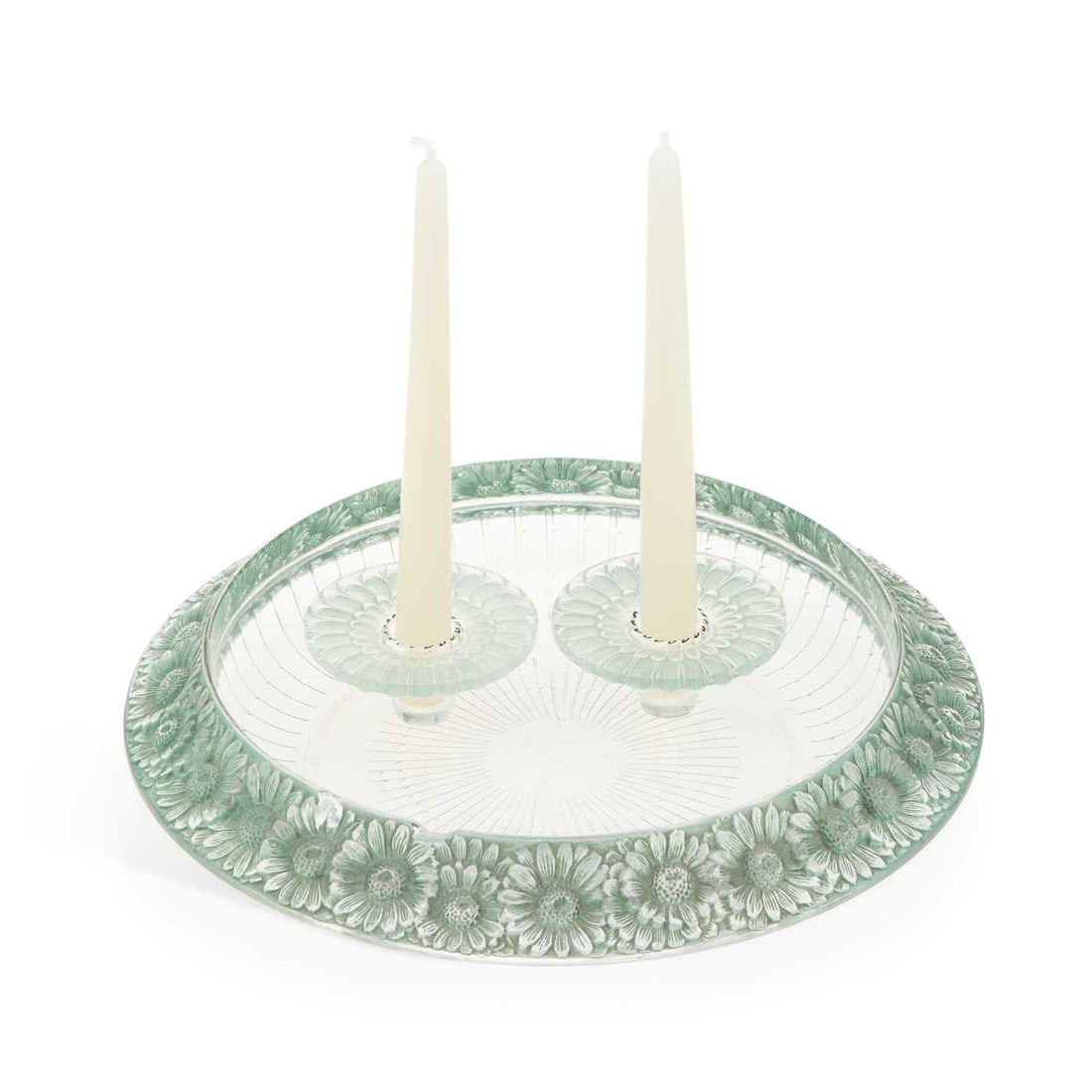 RENE LALIQUE (FRENCH, 1860-1945) A 'MARGUERITES' BOWL AND TWO CANDLE HOLDERS: the large shallow bowl moulded with flowers and with green staining; together with two similar candle holders; each signed R. LALIQUE. (3) Bowl 34cm diameter Two chips to rim, surface scratch to bowl,