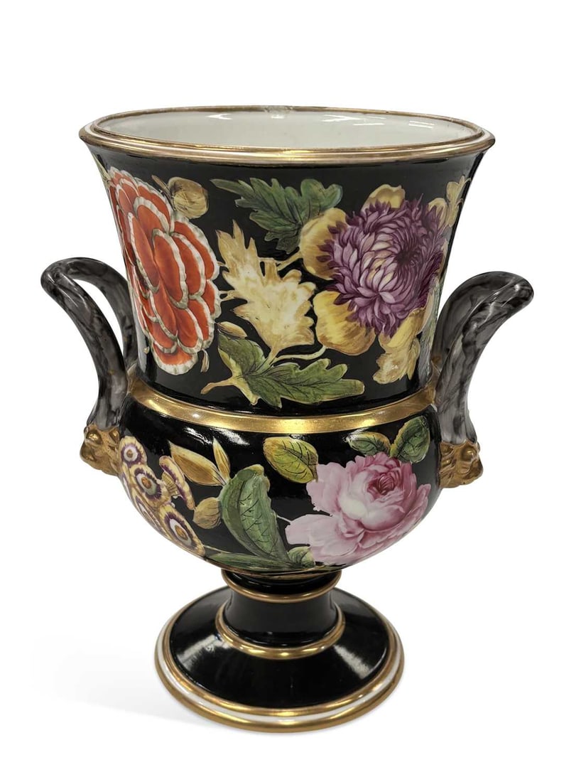 A SPODE PORCELAIN CAMPANA VASE CIRCA 1820: of campana form with marbled scroll handles terminating in gilt lion masks, painted with roses, chrysanthemums, tulips and other flowers reserved on a black ground within gilt bands, raised on a