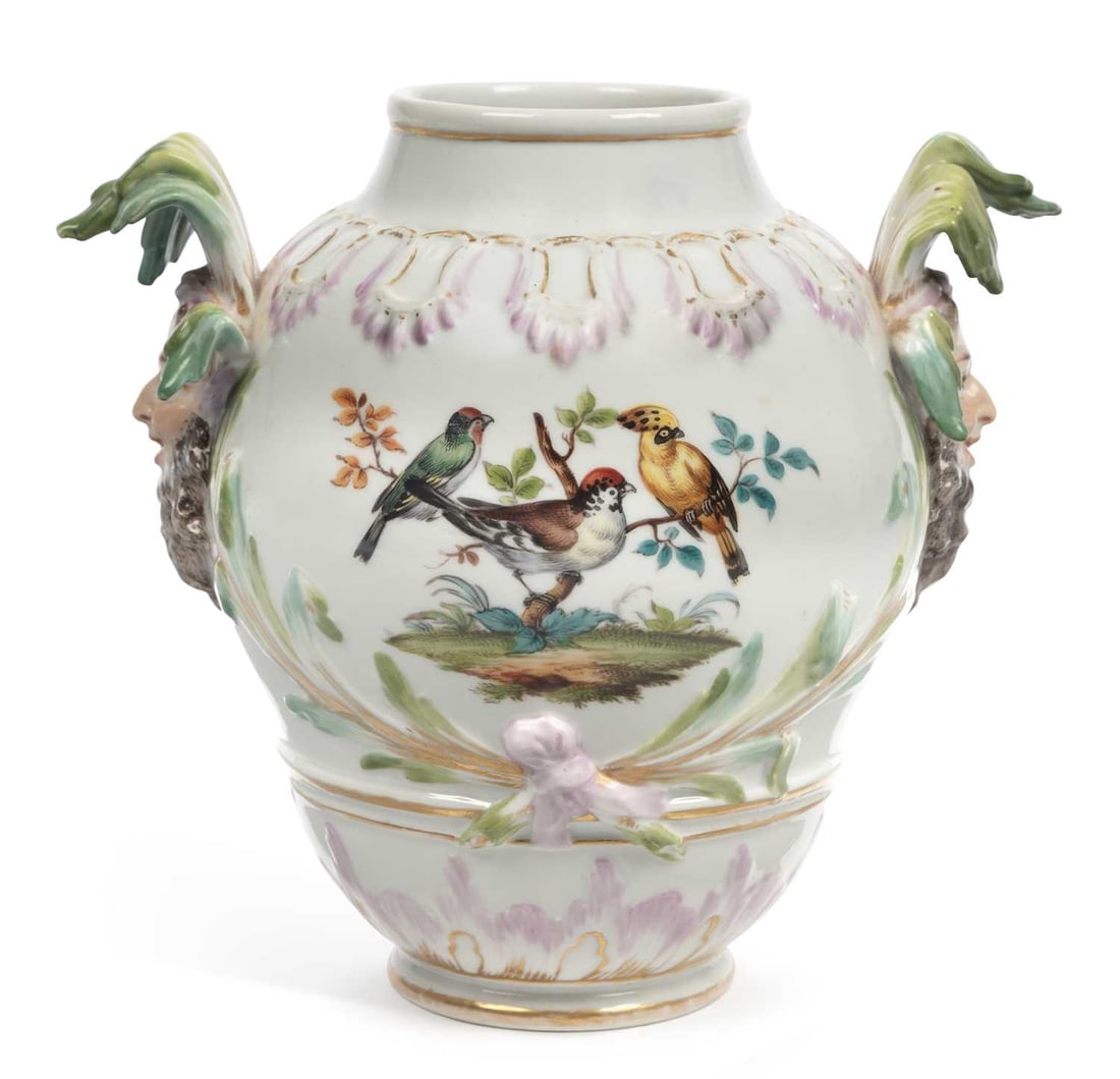 A BERLIN PORCELAIN VASE CIRCA 1870: having twin mask handles, painted with a scene of birds perched in a tree, and flowers to the reverse, underglaze blue sceptre mark to the base. 21cm high