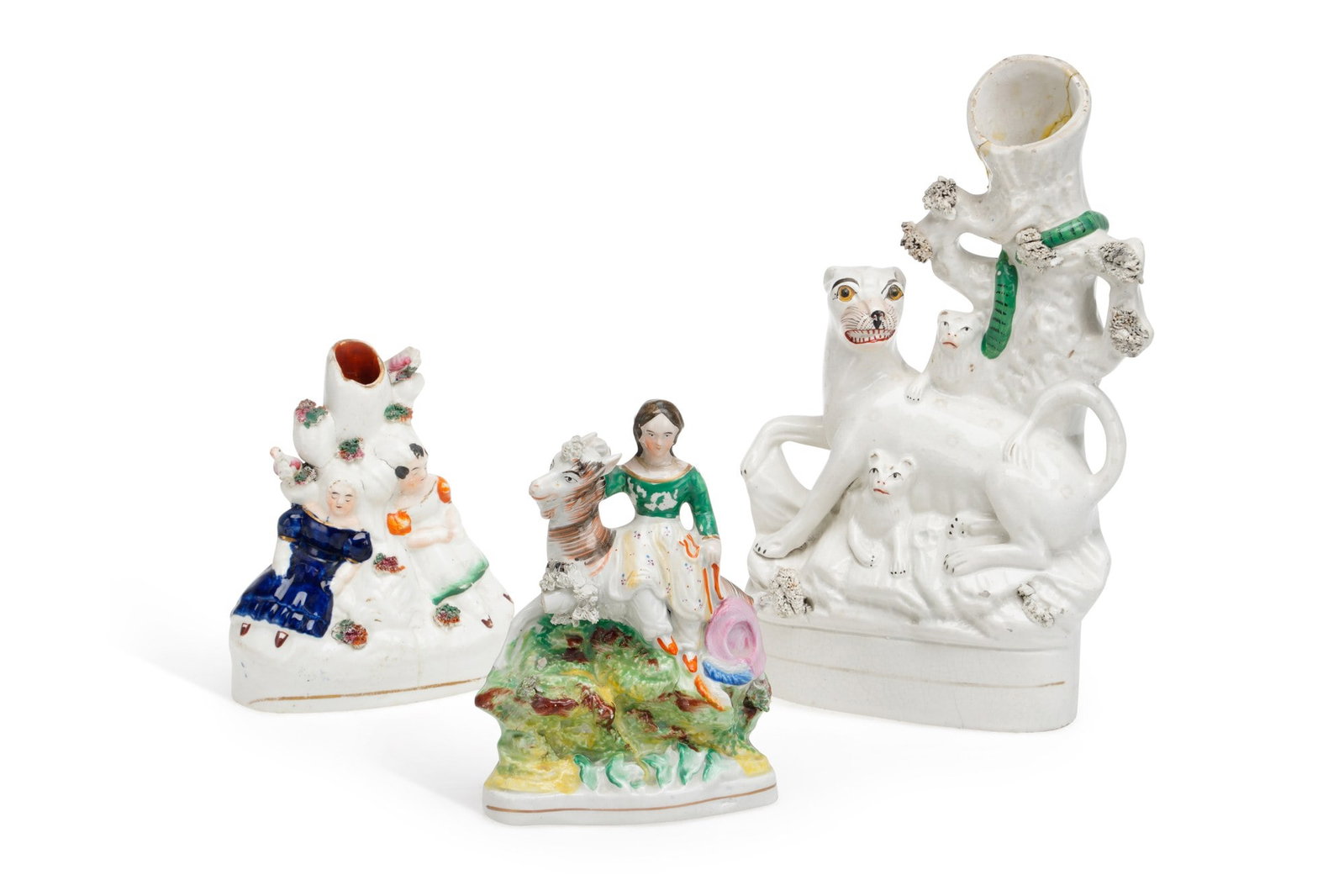 THREE STAFFORDSHIRE FIGURES CIRCA 1860: comprising of a spill vase modelled as a tiger and her cubs, with a snake in the tree; a girl seated upon a goat; and a Babes in the Woods spill vase. (3) First 25cm high