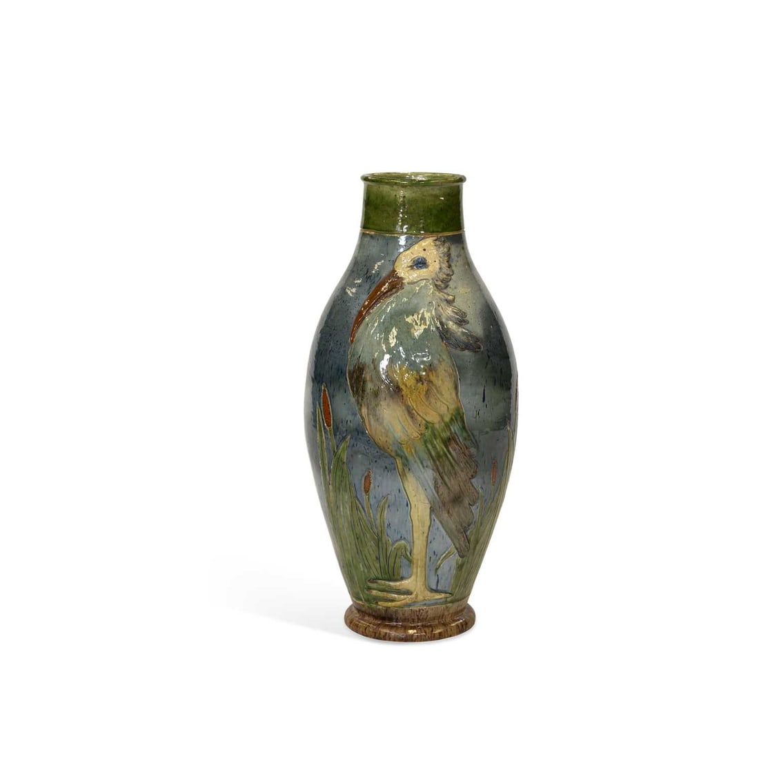 A LARGE BELGIAN EARTHENWARE PELICAN VASE CIRCA 1910: decorated in the Arts and Crafts style with a pelican standing amongst bulrushes, probably Maes Pottery. 77cm high Additional photographs added, there are a few cracks to the glaze but not major