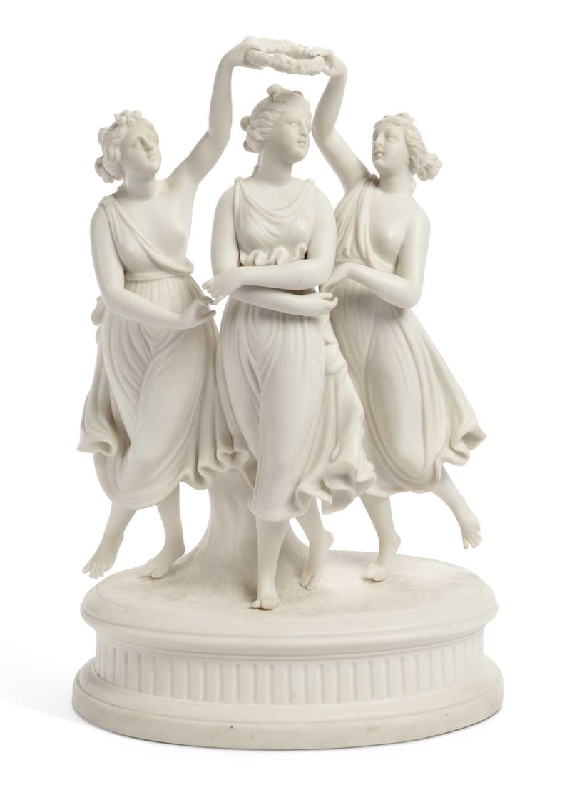 AN ENGLISH PARIAN GROUP, 'THE THREE GRACES' CIRCA 1860: modelled as The Three Graces dancing, with a laurel wreath, on an oval mound base. 37.5cm high