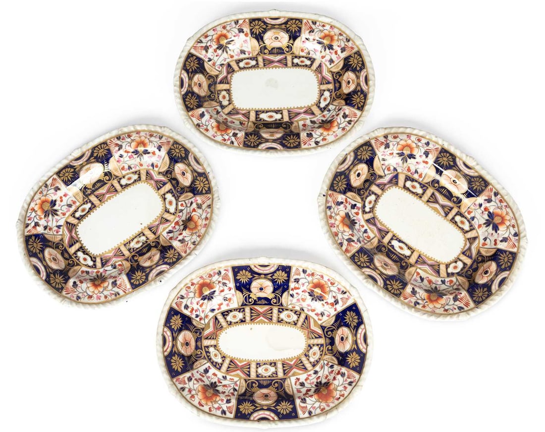 A SET OF FOUR DERBY DISHES EARLY 19TH CENTURY: each with a moulded rim and richly decorated in the Imari palette with alternating floral and geometric panels in cobalt blue, iron-red, pink and gilt, painted marks and pattern number 44 to the