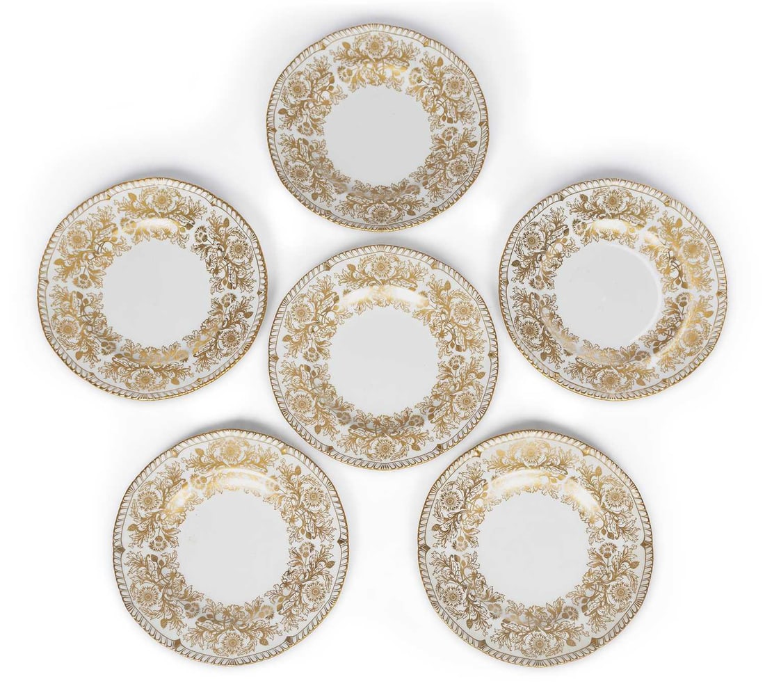 A SET OF SIX ROYAL CROWN DERBY PLATES DATED 1974: the plates decorated in the Brocade pattern of gilt flowering plants, within a moulded gadroon rim. (6) 26.5cm diameter