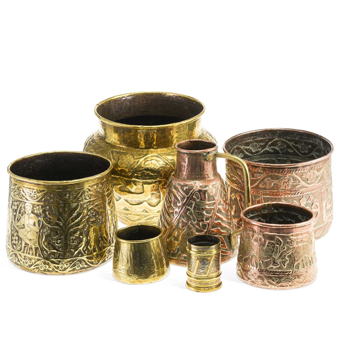 A COLLECTION OF PERSIAN BRASS AND COPPER VESSELS 19TH CENTURY: variously embossed and engraved with figures, animals, foliage and geometric motifs. (7) Tallest 25cm high