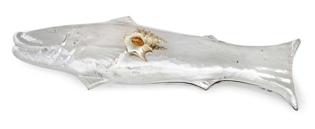 A LARGE ITALIAN WHITE METAL FISH SERVING DISH AND COVER: by Egidio Broggi, Milan, modelled as a fish with a planished body, the cover applied with a gilt shell handle, stamped mark. 55cm long