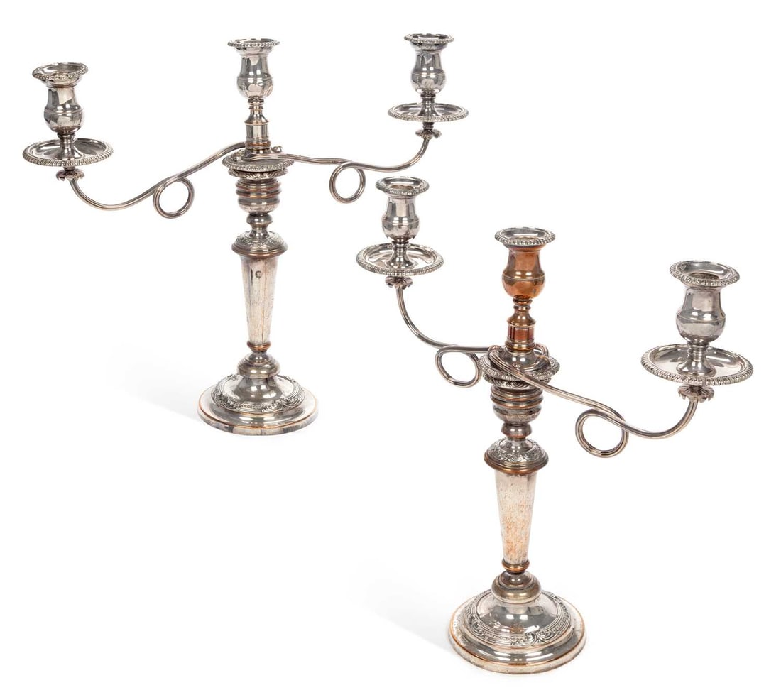 A PAIR OF OLD SHEFFIELD PLATE THREE-LIGHT CANDELABRA: each tapering knopped column supporting an associated detachable reeded and scrolling two-arm superstructure from the central sconce, raised on a circular foot, with bands of bead and scroll