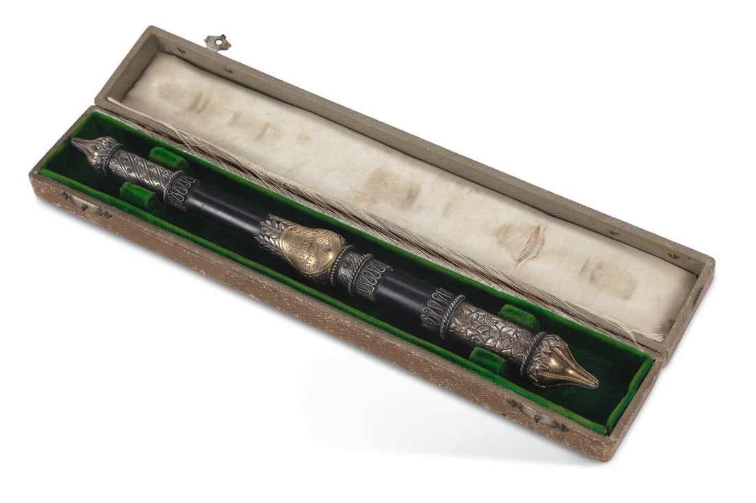 A GERMAN SILVER-MOUNTED PRESENTATION CONDUCTOR'S BATON: the ebonised shaft with silver and silver-gilt mounts, the central boss embossed to one side with Arion seated upon a dolphin playing his lyre, the reverse inscribed GESANG-VEREIN ARION AM GYMNASIUM Z
