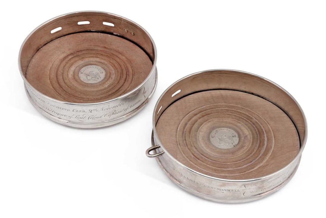 A RARE PAIR OF NOVELTY GEORGE III SCOTTISH SILVER WINE COASTERS: Edinburgh 1819, maker's mark rubbed, possibly by William & Patrick Cunningham, each modelled as a dog collar, one with a padlock, the other engraved with a hare coursing scene, each presentation engra