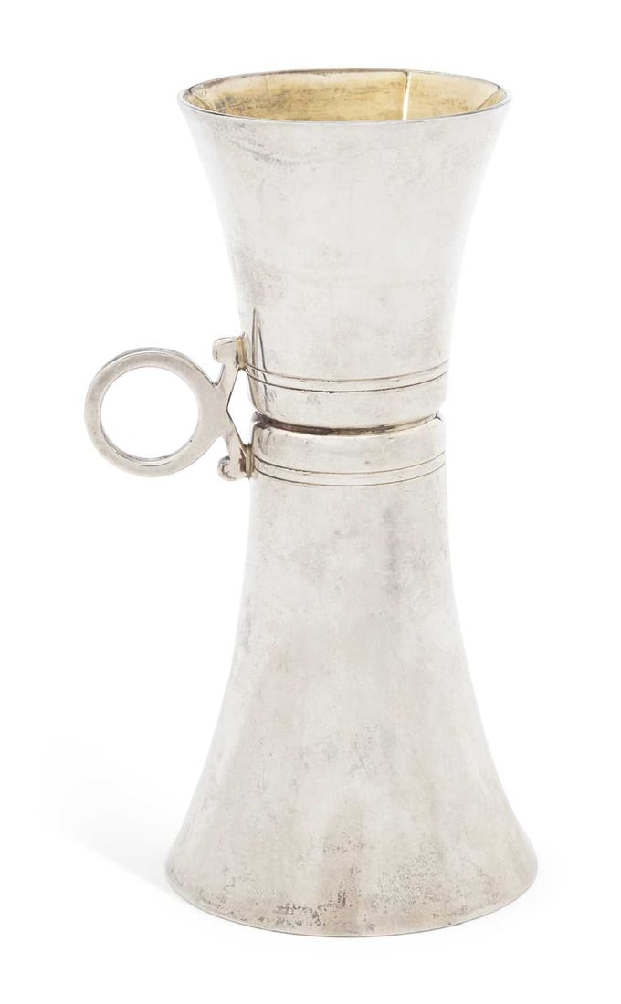 AN ELIZABETH II SILVER JIGGER (1 of 2)