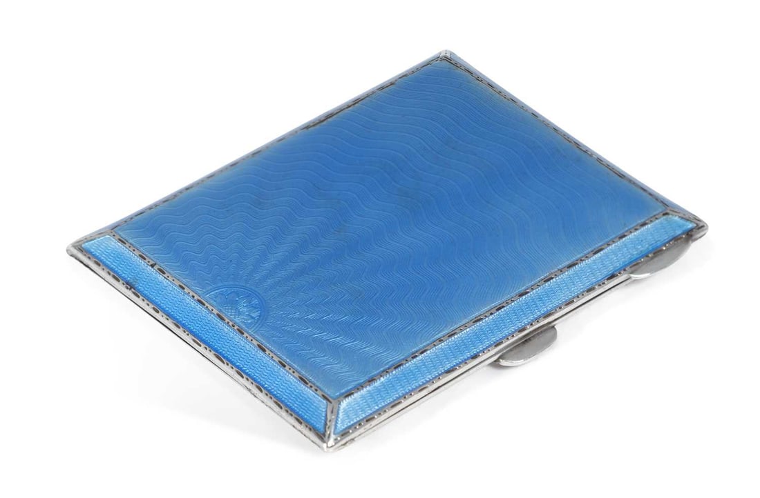 A GEORGE VI SILVER AND ENAMEL CIGARETTE CASE: by Turner & Simpson, Birmingham 1936, rectangular, with sunburst pattern pale blue guilloche enamel, gilded to the interior. 8.5cm high, 7cm wide, 3.5 troy ounces