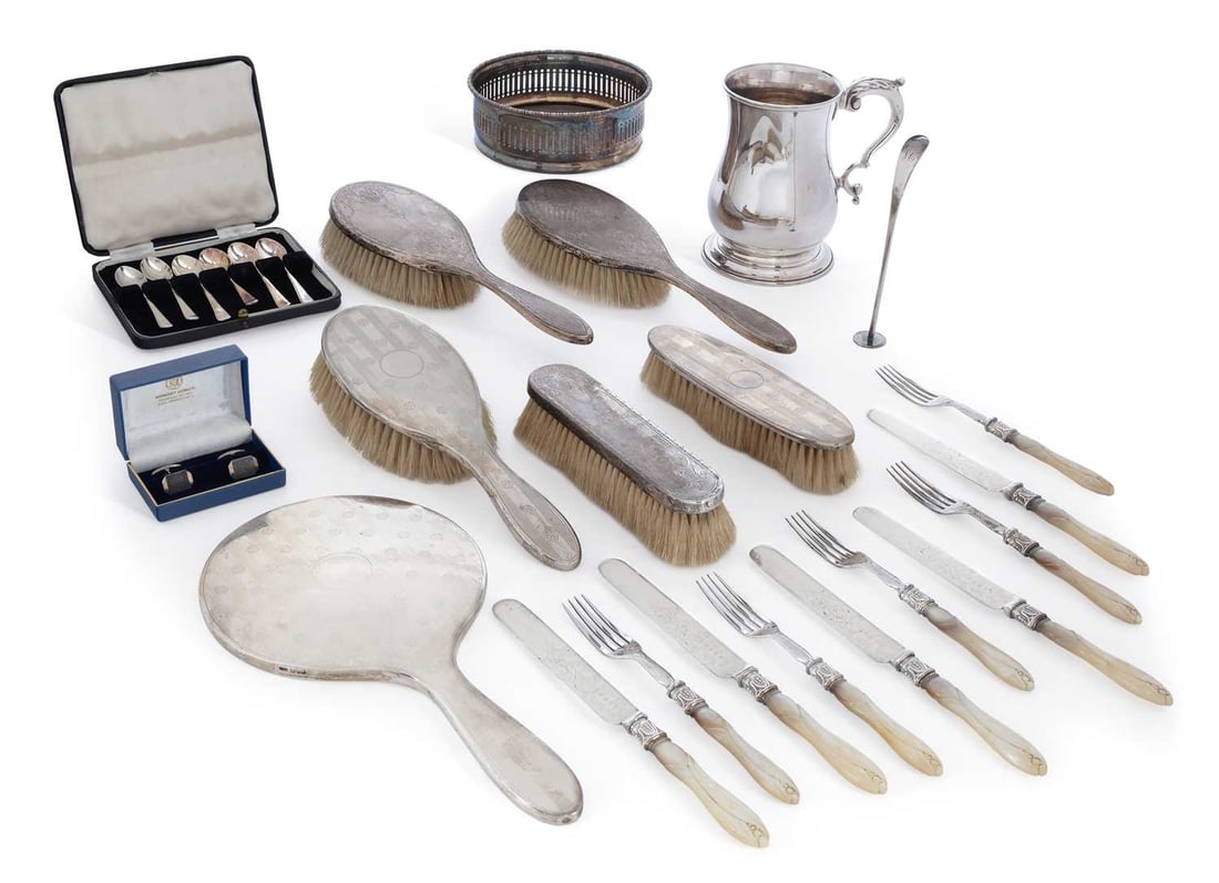 A GROUP OF GEORGE V AND LATER SILVER AND SILVER-PLATE: including a George V three-piece silver-backed dressing table set by Stokes & Ireland Ltd., Chester 1921, engraved with linear and flower head motif; together with a further matched George V three-pie