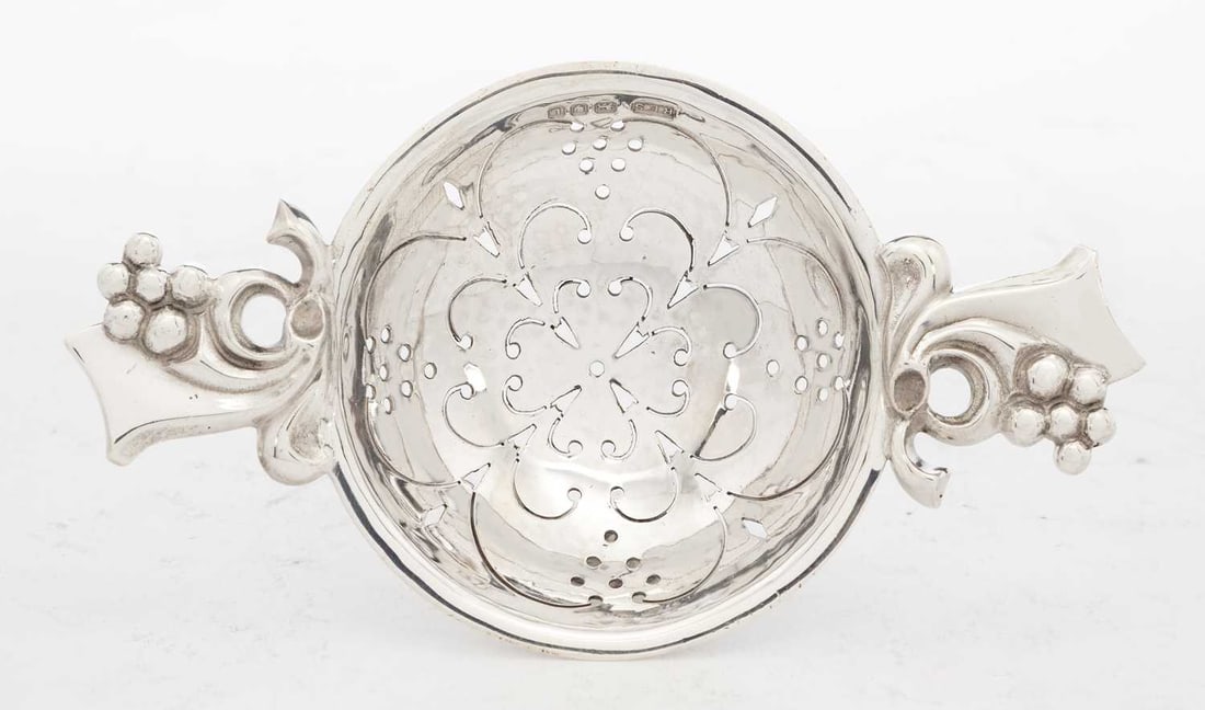 A SILVER TEA STRAINER ON STAND - 2