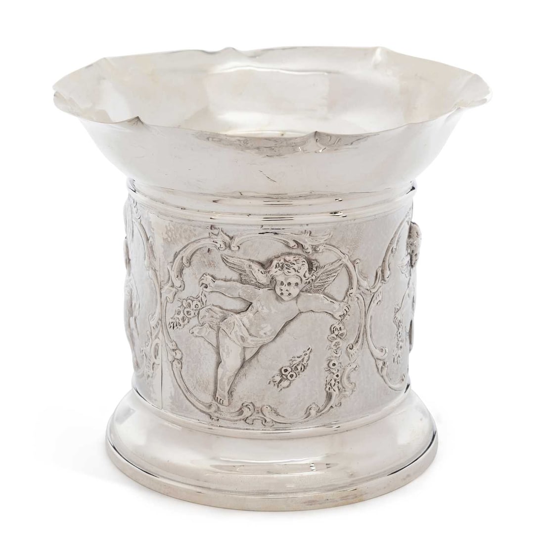 AN EDWARDIAN SILVER PLANTER: by Goldsmiths & Silversmiths Co Ltd, London 1906, of cylindrical form with a flared rim, chased with putti within scroll panels. 11cm high, 5 troy ounces
