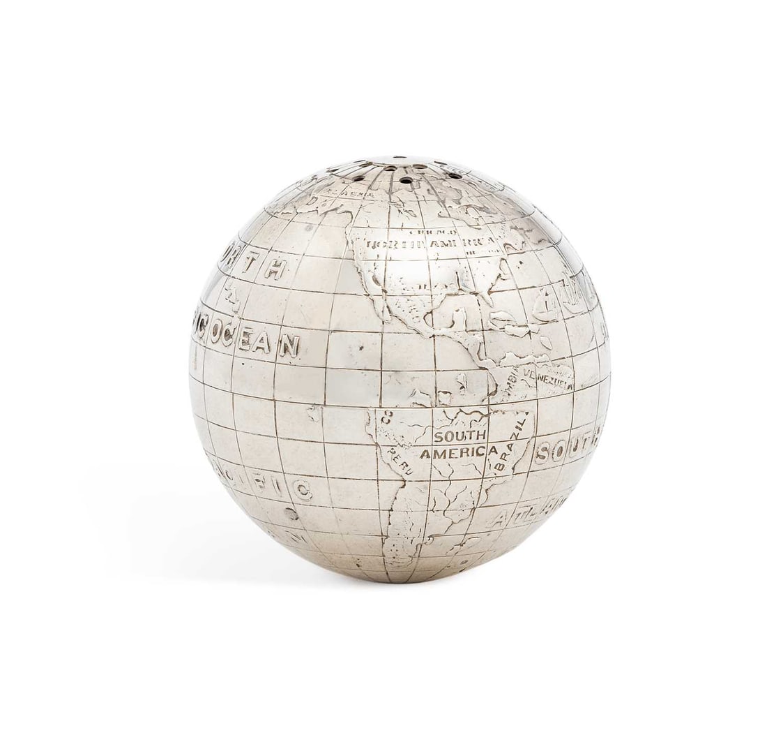 A NOVELTY STERLING SILVER GLOBE PEPPER POT 20TH CENTURY: of spherical form with a pierced top, embossed with continents and oceans, marked to base 223785 Sterling. 4cm high, 2.1 troy ounces Good condition, light signs of wear in commensurate with age and